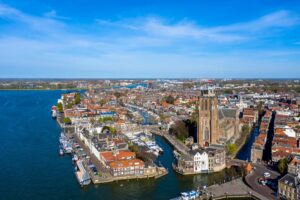 Aerial view of Dordrecht, Netherlands, home to Unit4’s global headquarters, with historic buildings, waterways, and the Grote Kerk.