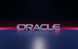 Oracle logo illuminated by pink and blue lighting against a dark background.